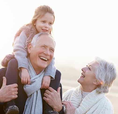 An older couple with their grandchild